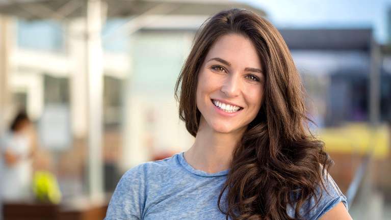 Smiling Woman with Porcelain Crowns in Northborough, MA