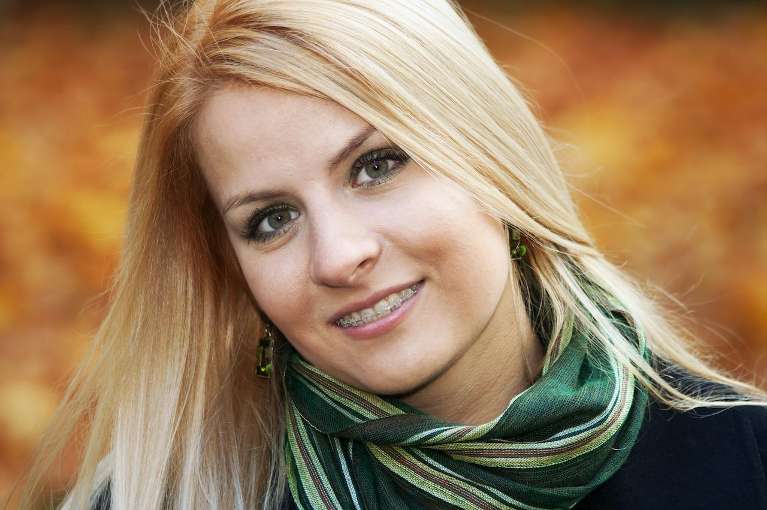 A happy woman after Early Orthodontic Evaluations in Northborough, MA