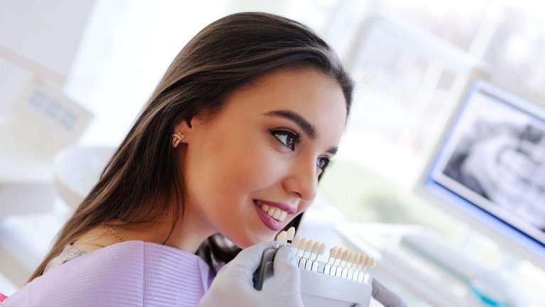 A white-toothed woman in a dental office in Northborough.