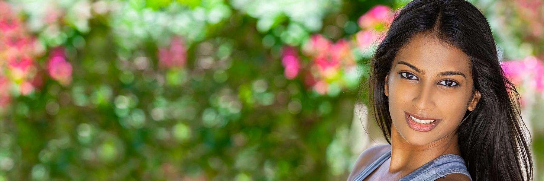 woman smiling in a garden near northborough